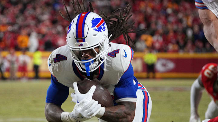 Jan 26, 2025; Kansas City, MO, USA; Buffalo Bills running back James Cook (4) dives for a touchdown against the Kansas City Chiefs in the AFC Championship game at GEHA Field at Arrowhead Stadium. Mandatory Credit: Denny Medley-Imagn Images