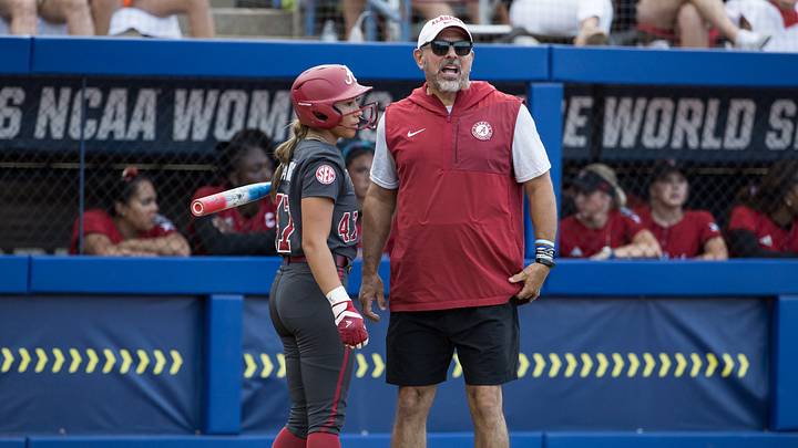 Jun 1, 2026; Oklahoma City, OK, USA; Alabama Crimson Tide head coach Patrick Murphy talks with infielder Salen Hawkins (47) in the fourth inning against the Texas Tech Red Raiders during the NCAA Women’s College World Series at Devon Park. Mandatory Credit: Brett Rojo-Imagn Images Jun 1, 2026; Oklahoma City, OK, USA; Alabama Crimson Tide head coach Patrick Murphy talks with infielder Salen Hawkins (47) in the fourth inning against the Texas Tech Red Raiders during the NCAA Women’s College World Series at Devon Park. Mandatory Credit: Brett Rojo-Imagn Images
