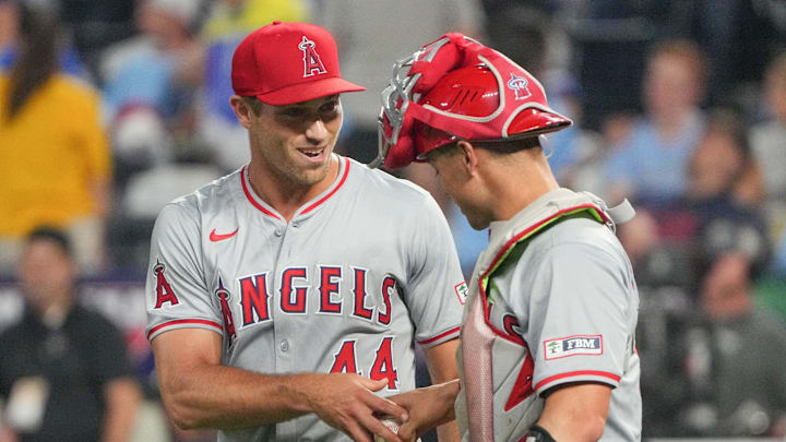 Aug 20, 2024; Kansas City, Missouri, USA; Los Angeles Angels pitcher Ben Joyce (44) celebrates with center fielder Kevin Pillar (12) after the win over the Kansas City Royals at Kauffman Stadium. Aug 20, 2024; Kansas City, Missouri, USA; Los Angeles Angels pitcher Ben Joyce (44) celebrates with center fielder Kevin Pillar (12) after the win over the Kansas City Royals at Kauffman Stadium.