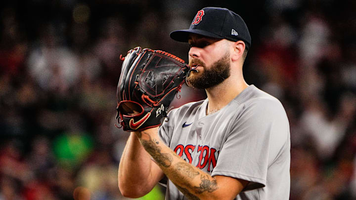 Boston Red Sox pitcher Lucas Giolito prepares to throw a baseball. 