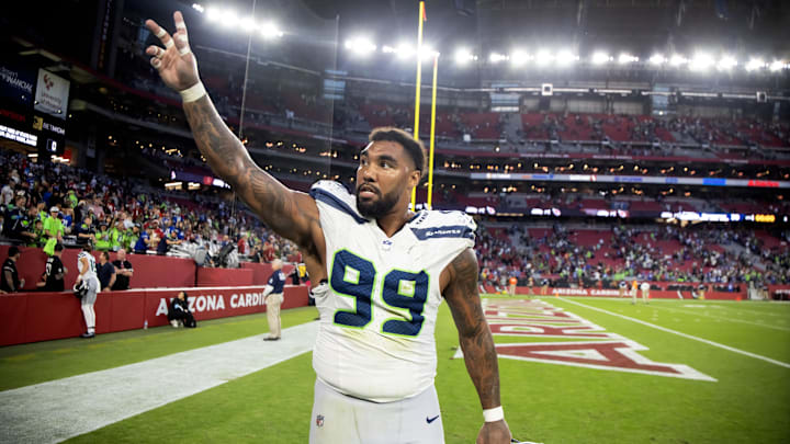 Dec 8, 2024; Glendale, Arizona, USA; Seattle Seahawks defensive end Leonard Williams (99) celebrates after defeating the Arizona Cardinals at State Farm Stadium. Mandatory Credit: Mark J. Rebilas-Imagn Images