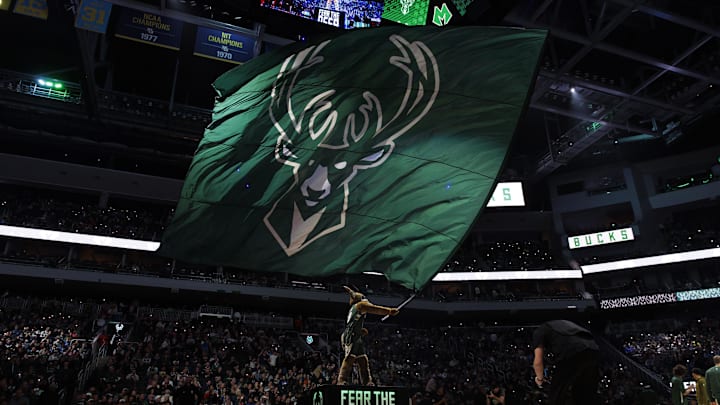 Nov 26, 2023; Milwaukee, Wisconsin, USA;  Milwaukee Bucks mascot Bango waves a flag with the Milwaukee Bucks logo prior to the game against the Portland Trail Blazers at Fiserv Forum. Mandatory Credit: Jeff Hanisch-Imagn Images