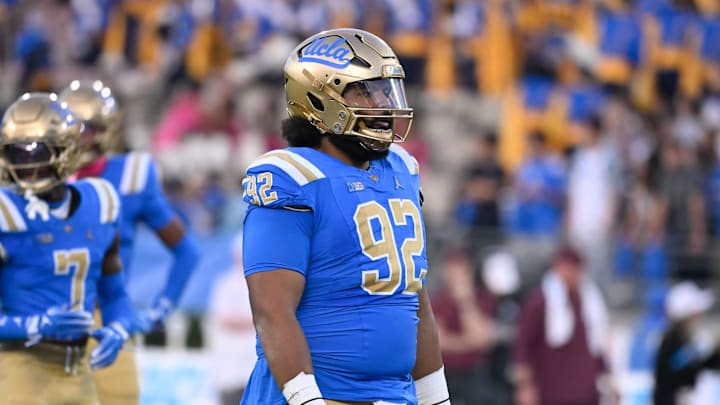 Oct 12, 2024; Pasadena, California, USA; UCLA Bruins defensive lineman Siale Taupaki (92) during the first quarter against the Minnesota Golden Gophers at Rose Bowl. Mandatory Credit: Robert Hanashiro-Imagn Images Oct 12, 2024; Pasadena, California, USA; UCLA Bruins defensive lineman Siale Taupaki (92) during the first quarter against the Minnesota Golden Gophers at Rose Bowl. Mandatory Credit: Robert Hanashiro-Imagn Images