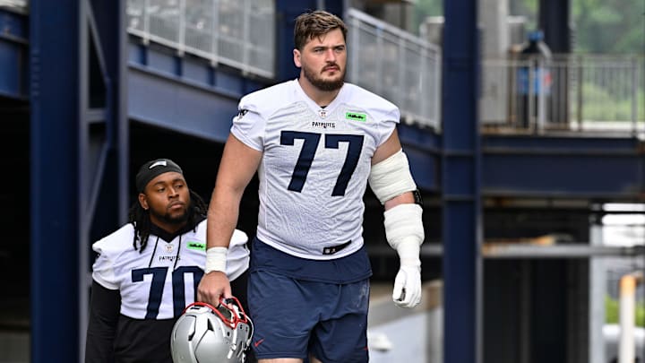 Jun 9, 2025; Foxborough, MA, USA; New England Patriots center Ben Brown (77) walks to the practice fields at Gillette Stadium. Mandatory Credit: Eric Canha-Imagn Images