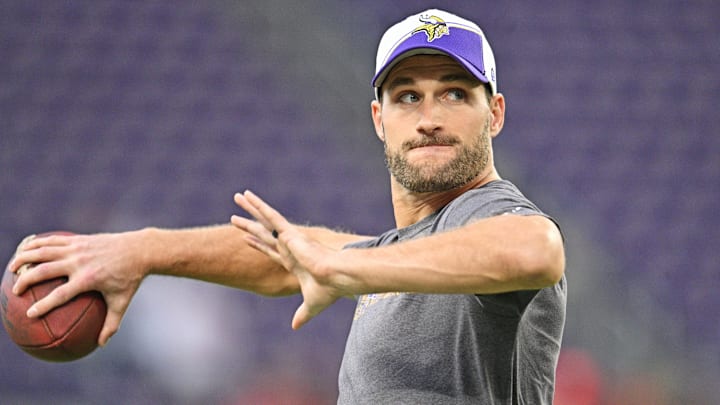 Quarterback Kirk Cousins (8) warms up.