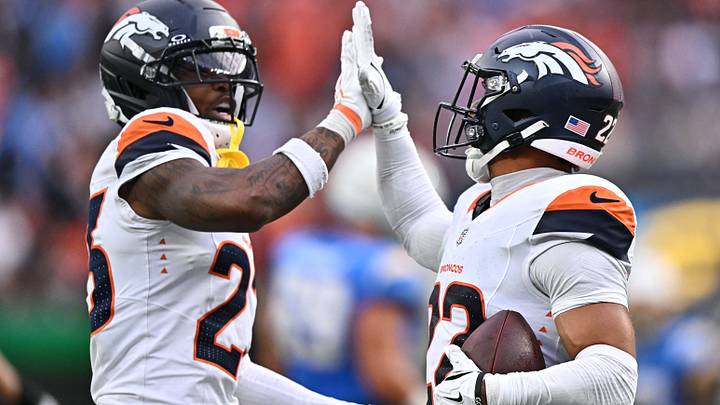 Denver Broncos defensive backs Jahdae Barron and Brandon Jones