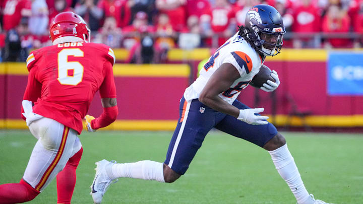 Nov 10, 2024; Kansas City, Missouri, USA; Denver Broncos wide receiver Lil'Jordan Humphrey (84) runs the ball as Kansas City Chiefs safety Bryan Cook (6) defends during the game at GEHA Field at Arrowhead Stadium. 