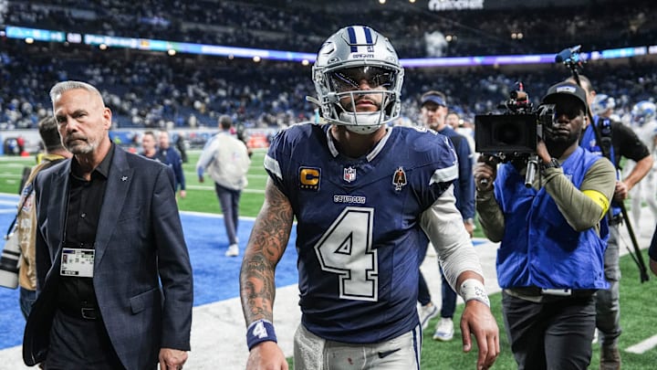 Dallas Cowboys quarterback Dak Prescott walks off the field after a 44-30 loss at Ford Field in Detroit 