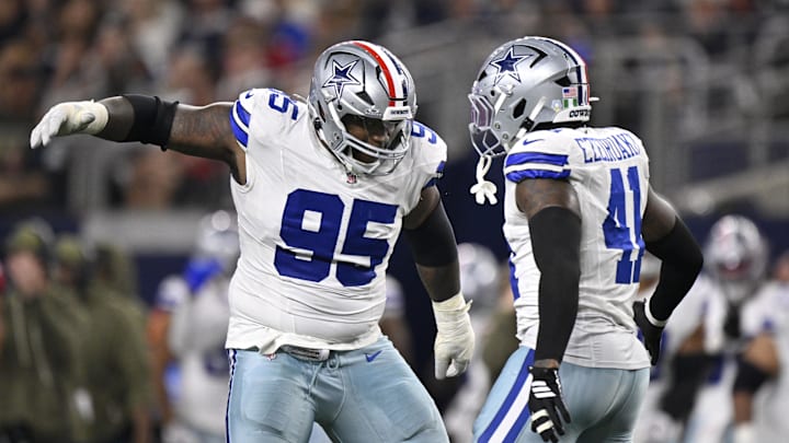Nov 3, 2025; Arlington, Texas, USA;  Dallas Cowboys defensive tackle Kenny Clark (95) celebrates with defensive end Donovan Ezeiruaku (41) after a sack against Arizona Cardinals quarterback Jacoby Brissett (7) in the second half at AT&T Stadium. Mandatory Credit: Jerome Miron-Imagn Images