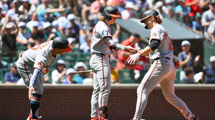 Jul 4, 2024; Seattle, Washington, USA;  Baltimore Orioles shortstop Gunnar Henderson (2) celebrates with designated hitter Heston Kjerstad (13) and catcher James McCann (27) after hitting a 2-run home run against the Seattle Mariners during the third inning at T-Mobile Park.