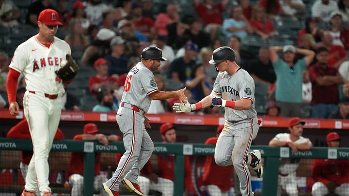 Sep 17, 2026; Anaheim, California, USA; Minnesota Twins center fielder Walker Jenkins (11) is congratulated by third base coach Ramon Borrego (46) after hitting a two-run home run in the ninth inning against Los Angeles Angels pitcher Ben Joyce (44) at Angel Stadium. Mandatory Credit: Kirby Lee-Imagn Images Sep 17, 2026; Anaheim, California, USA; Minnesota Twins center fielder Walker Jenkins (11) is congratulated by third base coach Ramon Borrego (46) after hitting a two-run home run in the ninth inning against Los Angeles Angels pitcher Ben Joyce (44) at Angel Stadium. Mandatory Credit: Kirby Lee-Imagn Images