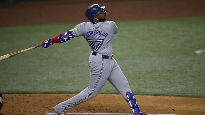 Sep 17, 2024; Arlington, Texas, USA; Toronto Blue Jays first baseman Vladimir Guerrero Jr. (27) hits a double and drives in a run against the Texas Rangers during the second inning at Globe Life Field. Mandatory Credit: Jerome Miron-Imagn Images Sep 17, 2024; Arlington, Texas, USA; Toronto Blue Jays first baseman Vladimir Guerrero Jr. (27) hits a double and drives in a run against the Texas Rangers during the second inning at Globe Life Field. Mandatory Credit: Jerome Miron-Imagn Images