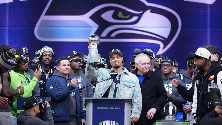 Feb 11, 2026; Seattle, WA, USA; Seattle Seahawks wide receiver Jaxon Smith-Njigba holds the Vince Lombardi trophy during the Super Bowl LX trophy celebration at Lumen Field. Mandatory Credit: Kirby Lee-Imagn Images