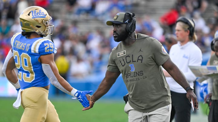 Nov 30, 2024; Pasadena, California, USA; UCLA Bruins head coach DeShaun Foster greets UCLA Bruins running back Anthony Frias II (29) as he returns to the bench during the third quarter against the Fresno State Bulldogs at Rose Bowl. Mandatory Credit: Robert Hanashiro-Imagn Images