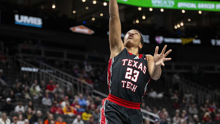 Mar 7, 2025; Kansas City, MO, USA; Texas Tech Lady Raiders guard Loghan Johnson (23) lays the ball up on a breakaway against the Oklahoma State Cowgirls during the second half at T-Mobile Center. Mandatory Credit: Amy Kontras-Imagn Images