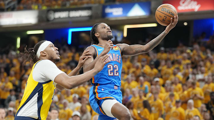 Jun 13, 2025; Indianapolis, Indiana, USA; Oklahoma City Thunder guard Cason Wallace (22) shoots the ball against Indiana Pacers center Myles Turner (33) during the first half during game four of the 2025 NBA Finals at Gainbridge Fieldhouse.
