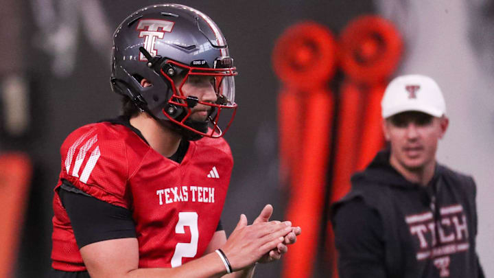 Texas Tech's Brendan Sorsby goes through a drill as offensive coordinator Mack Leftwich looks on during spring football practice, Tuesday, March 24, 2026, at the Womble Football Center.