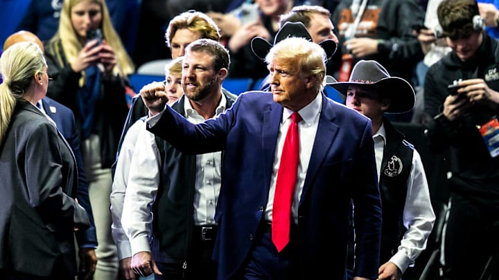 President Donald Trump greets fans as he arrives before the finals during the 2023 NCAA Wrestling Championships at the BOK Center in Tulsa, Oklkahoma. 
