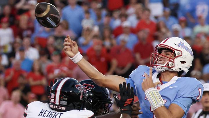 Oct 4, 2025; Houston, Texas, USA; Houston Cougars quarterback Conner Weigman (1) passes while being rushed by Texas Tech Red Raiders defensive end Romello Height (9) in the first half at TDECU Stadium. Mandatory Credit: Thomas Shea-Imagn Images Oct 4, 2025; Houston, Texas, USA; Houston Cougars quarterback Conner Weigman (1) passes while being rushed by Texas Tech Red Raiders defensive end Romello Height (9) in the first half at TDECU Stadium. Mandatory Credit: Thomas Shea-Imagn Images