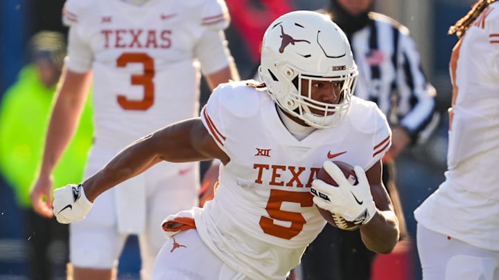 Nov 19, 2022; Lawrence, Kansas, USA; Texas Longhorns running back Bijan Robinson (5) runs the ball during the first half against the Kansas Jayhawks at David Booth Kansas Memorial Stadium. Mandatory Credit: Jay Biggerstaff-Imagn Images Nov 19, 2022; Lawrence, Kansas, USA; Texas Longhorns running back Bijan Robinson (5) runs the ball during the first half against the Kansas Jayhawks at David Booth Kansas Memorial Stadium. Mandatory Credit: Jay Biggerstaff-Imagn Images