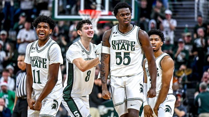 Michigan State's Coen Carr, center, celebrates with, from left, Jase Richardson, Frankie Fidler and Jaden Akins after Carr's 3-pointer against Florida Atlantic during the second half on Saturday, Dec. 21, 2024, in East Lansing.