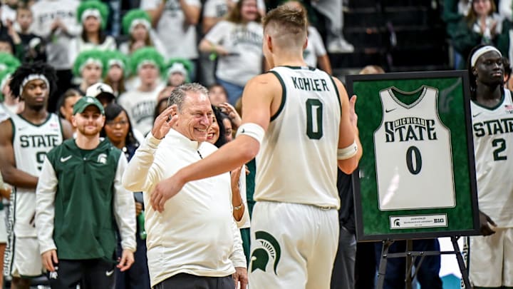 Michigan State's head coach Tom Izzo, left, prepares to hug Jaxon Kohler during the senior night ceremony after the Spartans win over Rutgers on Thursday, March 5, 2026, at the Breslin Center in East Lansing.