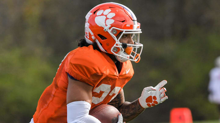 Clemson running back Chez Mellusi(27) runs during football practice in Clemson, S.C. Monday, March 22, 2021