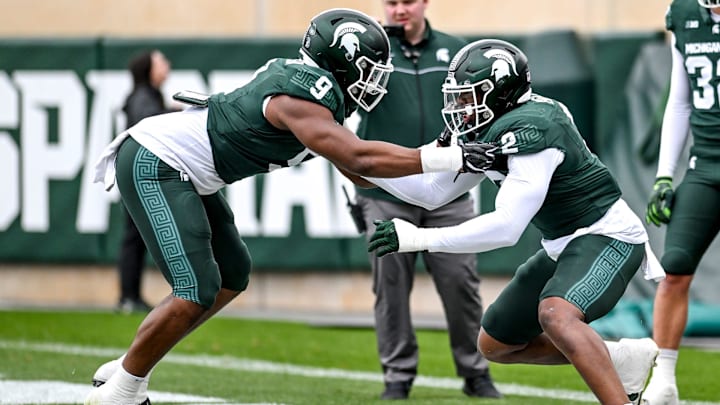 Michigan State's Jalen Thompson, left, and Khris Bogle work out in a drill during the Spring Showcase on Saturday, April 20, 2024, at Spartan Stadium in East Lansing.