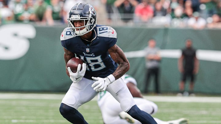 Oct 3, 2021; East Rutherford, New Jersey, USA; Tennessee Titans wide receiver Josh Reynolds (18) gains yards after the catch against the New York Jets during the second half at MetLife Stadium. Mandatory Credit: Vincent Carchietta-Imagn Images