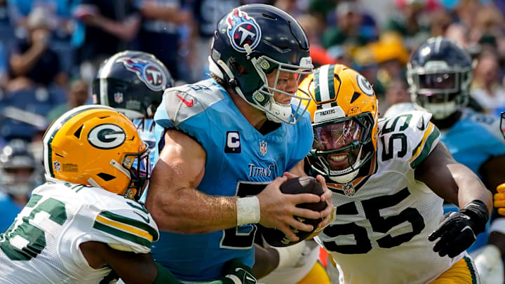 Tennessee Titans quarterback Will Levis (8) is sacked by Green Bay Packers linebacker Edgerrin Cooper (56) and defensive end Kingsley Enagbare (55) during the fourth quarter at Nissan Stadium in Nashville, Tenn., Sunday, Sept. 22, 2024.