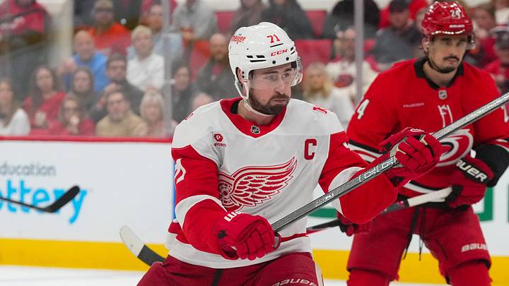 Feb 28, 2026; Raleigh, North Carolina, USA;  Detroit Red Wings center Dylan Larkin (71) takes a shot against the Carolina Hurricanes during the second period at Lenovo Center. Mandatory Credit: James Guillory-Imagn Images
