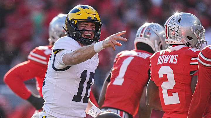 Michigan quarterback Davis Warren (16) celebrates a first down against Ohio State during the second half at Ohio Stadium in Columbus, Ohio on Saturday, Nov. 30, 2024.