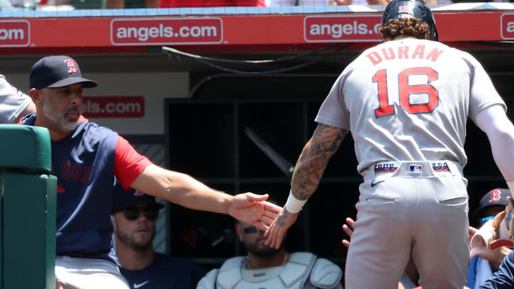 Jun 25, 2025; Anaheim, California, USA; Boston Red Sox left fielder Jarren Duran (16) is greeted by manager Alex Cora (13, left) after scoring a run during the first inning against the Los Angeles Angels at Angel Stadium. Mandatory Credit: Kiyoshi Mio-Imagn Images Jun 25, 2025; Anaheim, California, USA; Boston Red Sox left fielder Jarren Duran (16) is greeted by manager Alex Cora (13, left) after scoring a run during the first inning against the Los Angeles Angels at Angel Stadium. Mandatory Credit: Kiyoshi Mio-Imagn Images