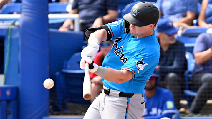 Miami Marlins left fielder Kyle Stowers (28) hits a single.
