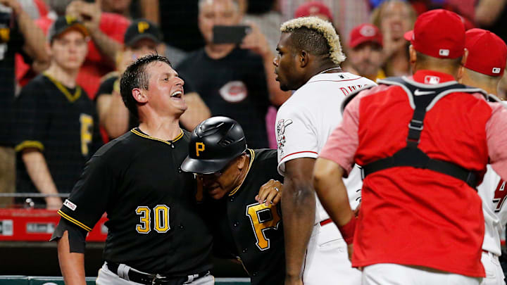 Pittsburgh Pirates relief pitcher Kyle Crick (30) and Cincinnati Reds right fielder Yasiel Puig (66) face off as the teams brawl in the ninth inning of the MLB National League game between the Cincinnati Reds and the Pittsburgh Pirates at Great American Ball Park in downtown Cincinnati on Tuesday, July 30, 2019. The Pirates won 11-4.

Pittsburgh Pirates At Cincinnati Reds