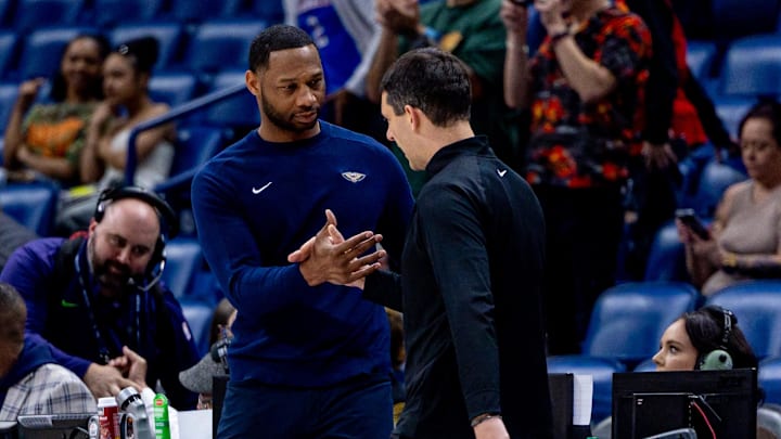 Apr 13, 2025; New Orleans, Louisiana, USA;  Oklahoma City Thunder head coach Mark Daigneault greets New Orleans Pelicans head coach Willie Green after the game at Smoothie King Center. Mandatory Credit: Stephen Lew-Imagn Images