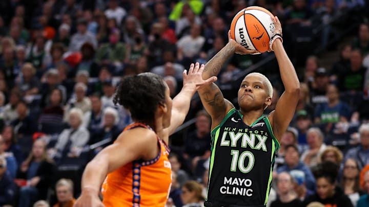 Minnesota Lynx guard Courtney Williams (10) shoots as Connecticut Sun forward Alyssa Thomas (25) defends.