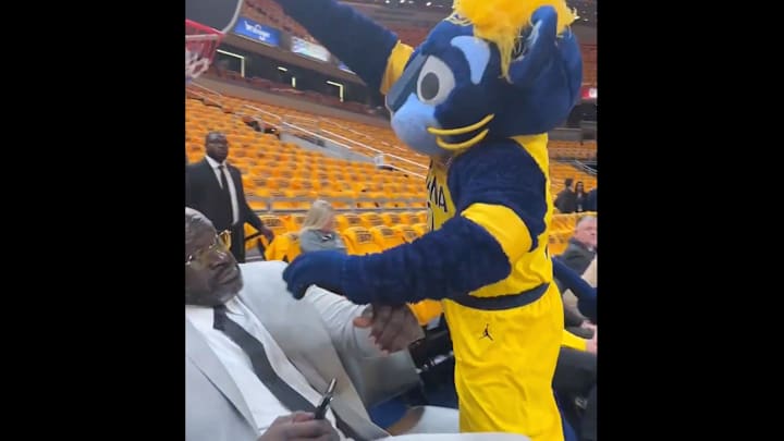 Boomer, the Indiana Pacers mascot, lunges over Shaquille O'Neal for a dunk on May 25, 2025.