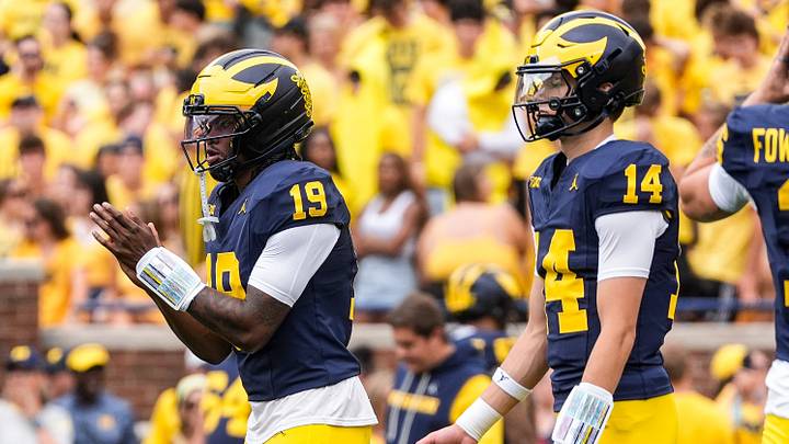 Michigan quarterback Bryce Underwood (19) practices next to quarterback Tommy Carr (14) at Michigan Stadium in Ann Arbor ahead of the game between Michigan and Oklahoma on Saturday, Sept. 12, 2026. Michigan quarterback Bryce Underwood (19) practices next to quarterback Tommy Carr (14) at Michigan Stadium in Ann Arbor ahead of the game between Michigan and Oklahoma on Saturday, Sept. 12, 2026.