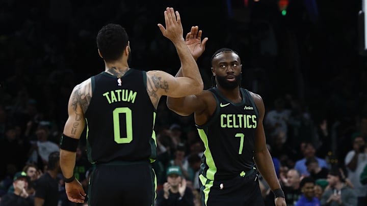 Feb 28, 2025; Boston, Massachusetts, USA; Boston Celtics guard Jaylen Brown (7) high fives forward Jayson Tatum (0) after the Cleveland Cavaliers called a timeout during the first quarter at TD Garden. Mandatory Credit: Winslow Townson-Imagn Images