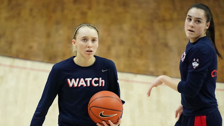 Mar 1, 2021; Storrs, Connecticut, USA; UConn Huskies guard Paige Bueckers (5) (left) and guard Nika Muhl (right) warm up before a game against the Marquette Golden Eagles at Harry A. Gampel Pavilion. Mandatory Credit: David Butler II-Imagn Images