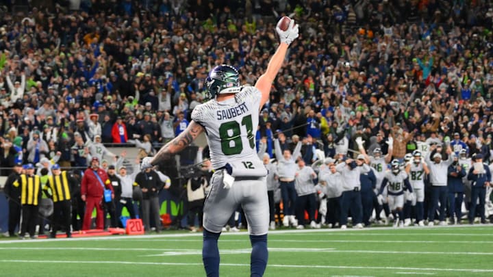 Dec 18, 2025; Seattle, Washington, USA; Seattle Seahawks tight end Eric Saubert (81) makes a catch for a game-winning two-point conversion against the Los Angeles Rams in overtime at Lumen Field. Mandatory Credit: Steven Bisig-Imagn Images