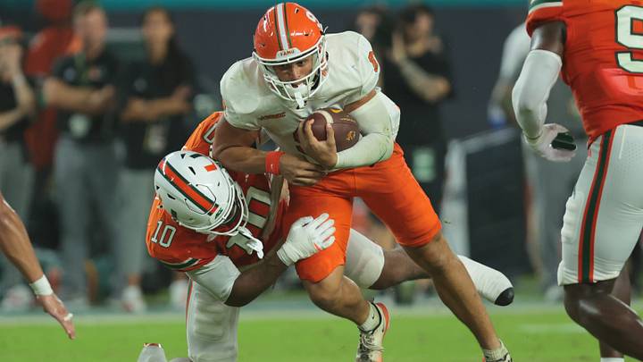 Sep 10, 2026; Miami Gardens, Florida, USA; Miami Hurricanes defensive lineman Damon Wilson II (10) sacks Florida A&M Rattlers quarterback Dustin Fletcher (9) in the first half at Hard Rock Stadium. Mandatory Credit: Sam Navarro-Imagn Images Sep 10, 2026; Miami Gardens, Florida, USA; Miami Hurricanes defensive lineman Damon Wilson II (10) sacks Florida A&M Rattlers quarterback Dustin Fletcher (9) in the first half at Hard Rock Stadium. Mandatory Credit: Sam Navarro-Imagn Images
