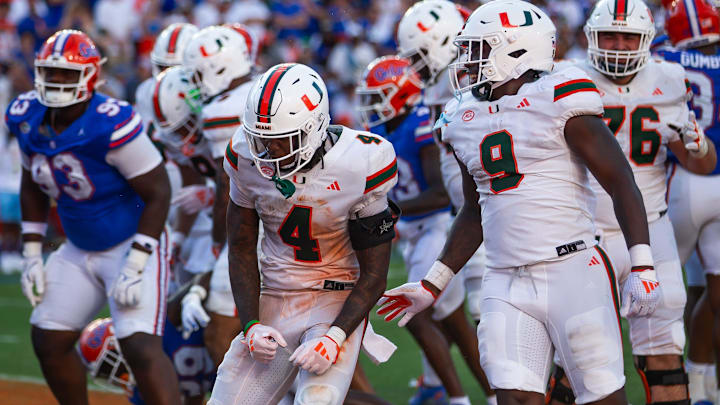 Miami Hurricanes running back Mark Fletcher Jr. (4) celebrates after goes up and over for a touchdown during the season opener at Ben Hill Griffin Stadium in Gainesville, FL on Saturday, August 31, 2024 against the University of Miami Hurricanes in the second half. Miami defeated the Gators 41-17. [Doug Engle/Gainesville Sun]