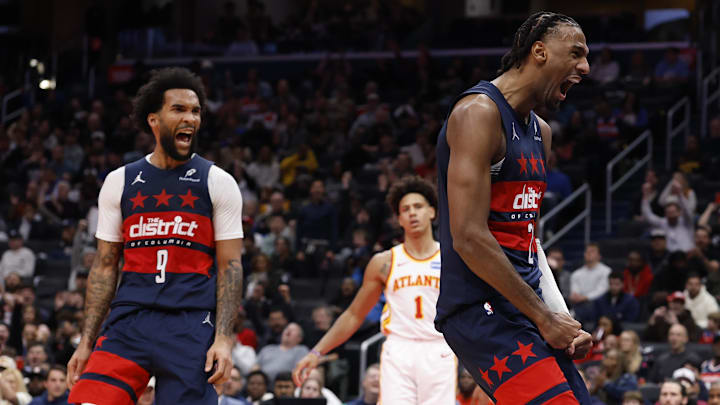 Nov 25, 2025; Washington, District of Columbia, USA; Washington Wizards center Alex Sarr (20) reacts after a dunk alongside Wizards forward Justin Champagnie (9) against the Atlanta Hawks in the second half at Capital One Arena. Mandatory Credit: Geoff Burke-Imagn Images
