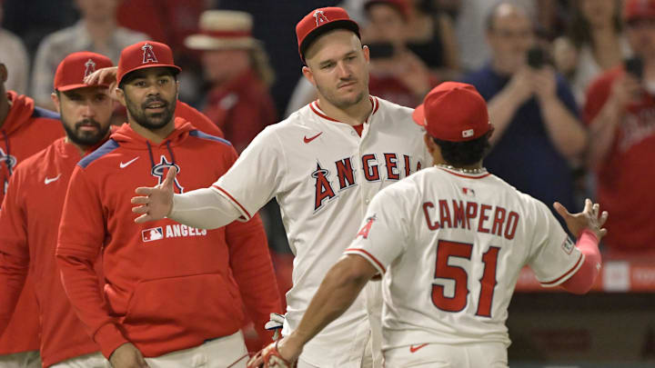 Jun 28, 2025; Anaheim, California, USA; Los Angeles Angels right fielder Mike Trout (27) greets right fielder Gustavo Campero (51) after the final out of the ninth inning defeating the Washington Nationals at Angel Stadium. Mandatory Credit: Jayne Kamin-Oncea-Imagn Images Jun 28, 2025; Anaheim, California, USA; Los Angeles Angels right fielder Mike Trout (27) greets right fielder Gustavo Campero (51) after the final out of the ninth inning defeating the Washington Nationals at Angel Stadium. Mandatory Credit: Jayne Kamin-Oncea-Imagn Images
