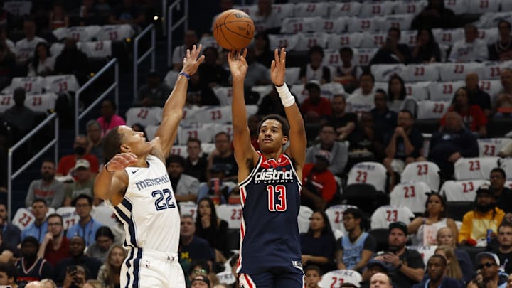 Oct 28, 2023; Washington, District of Columbia, USA; Washington Wizards guard Jordan Poole (13) shoots the ball over Memphis Grizzlies guard Desmond Bane (22) in the first quarter at Capital One Arena. Mandatory Credit: Geoff Burke-Imagn Images