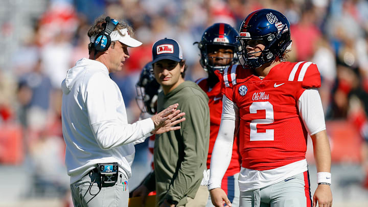 Nov 18, 2023; Oxford, Mississippi, USA; Mississippi Rebels head coach Lane Kiffin (left) talks with
