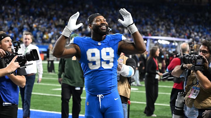 Dec 5, 2024; Detroit, Michigan, USA;  Detroit Lions defensive end Za'Darius Smith (99) celebrates with the fans as he walks off the field following the Lions win over the Green Bay Packers at Ford Field. Mandatory Credit: Lon Horwedel-Imagn Images