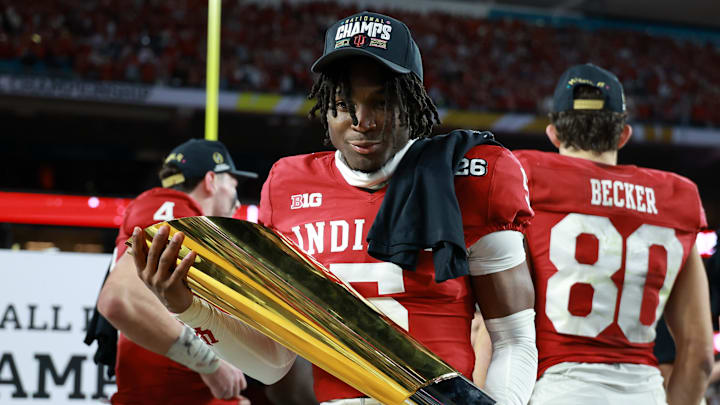Jan 19, 2026; Miami Gardens, FL, USA; Indiana Hoosiers defensive back D'Angelo Ponds (5) reacts with the trophy after the College Football Playoff National Championship game at Hard Rock Stadium. Mandatory Credit: Mark J. Rebilas-Imagn Images